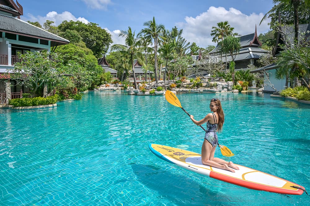 Paddle board your way to happiness at our lagoon pool