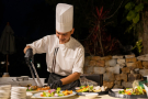 A chef preparing grilled dishes at Crocodile Bar & Grill