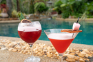 Refreshing cocktails beside the pool at Thavorn Beach Village Resort