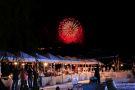 A festive beach wedding reception with fireworks in Phuket
