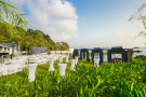 An outdoor wedding reception venue surrounded by lush greenery in Phuket