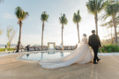 Bride and groom walking towards a wedding altar on a beach in Phuket