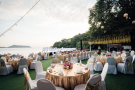 Outdoor beachside wedding venue in Phuket with round tables and ocean view